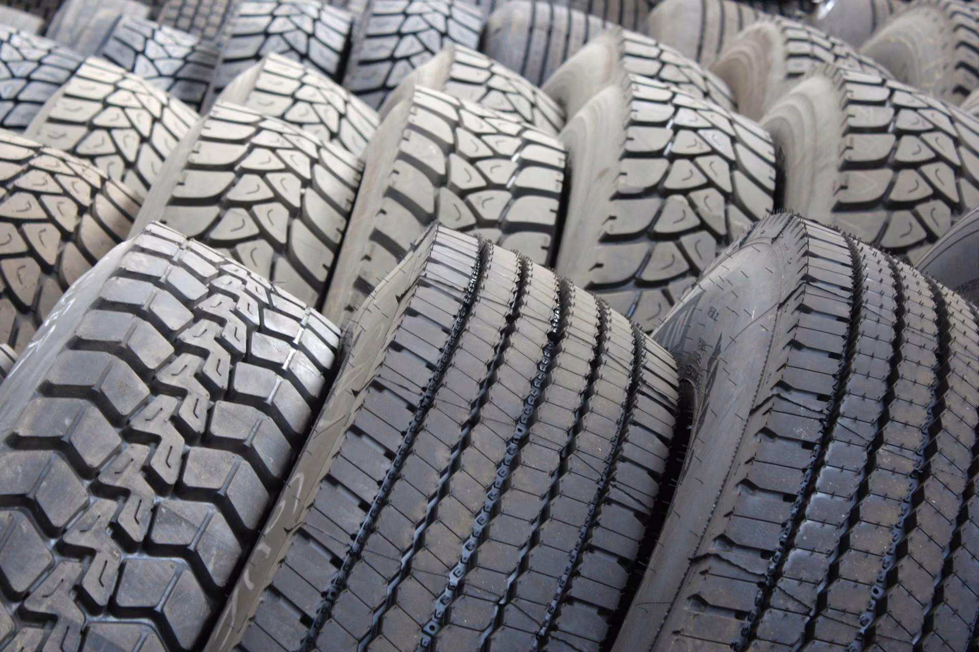Stacked tires showing deep tread patterns